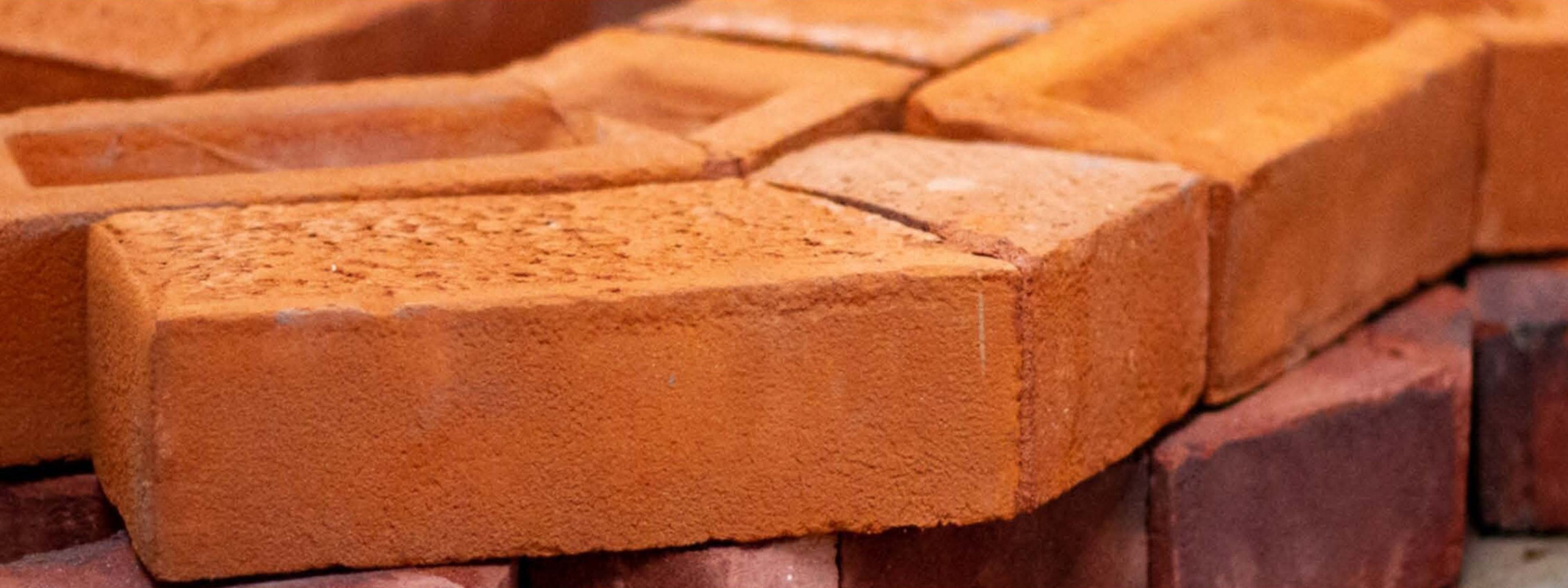 cut and bonded red house bricks 